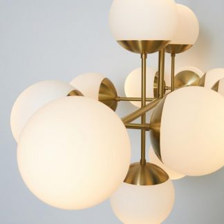 RUBN-ceiling-long-lord-grand-ceiling-brass-12-opal-glass-globes-golden-closeup-high-933×1000